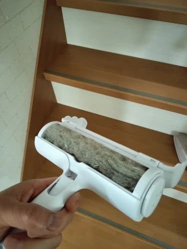 Pet hair remover roller lifting fur from stairs carpet
