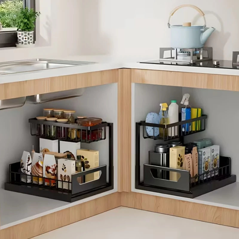 Under sink organizers in a kitchen cabinet